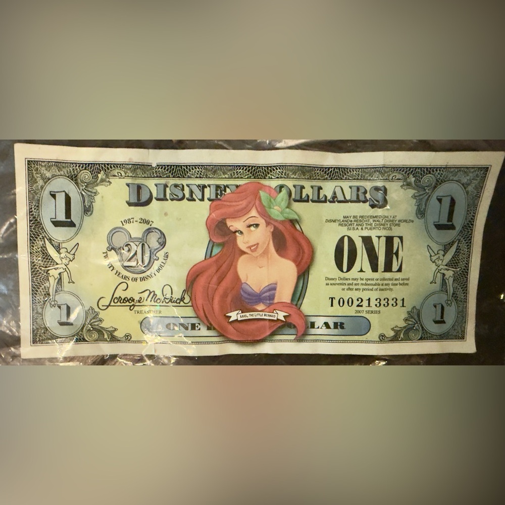 $I Ariel 2007 Disney Dollar Disney Store - Block T -